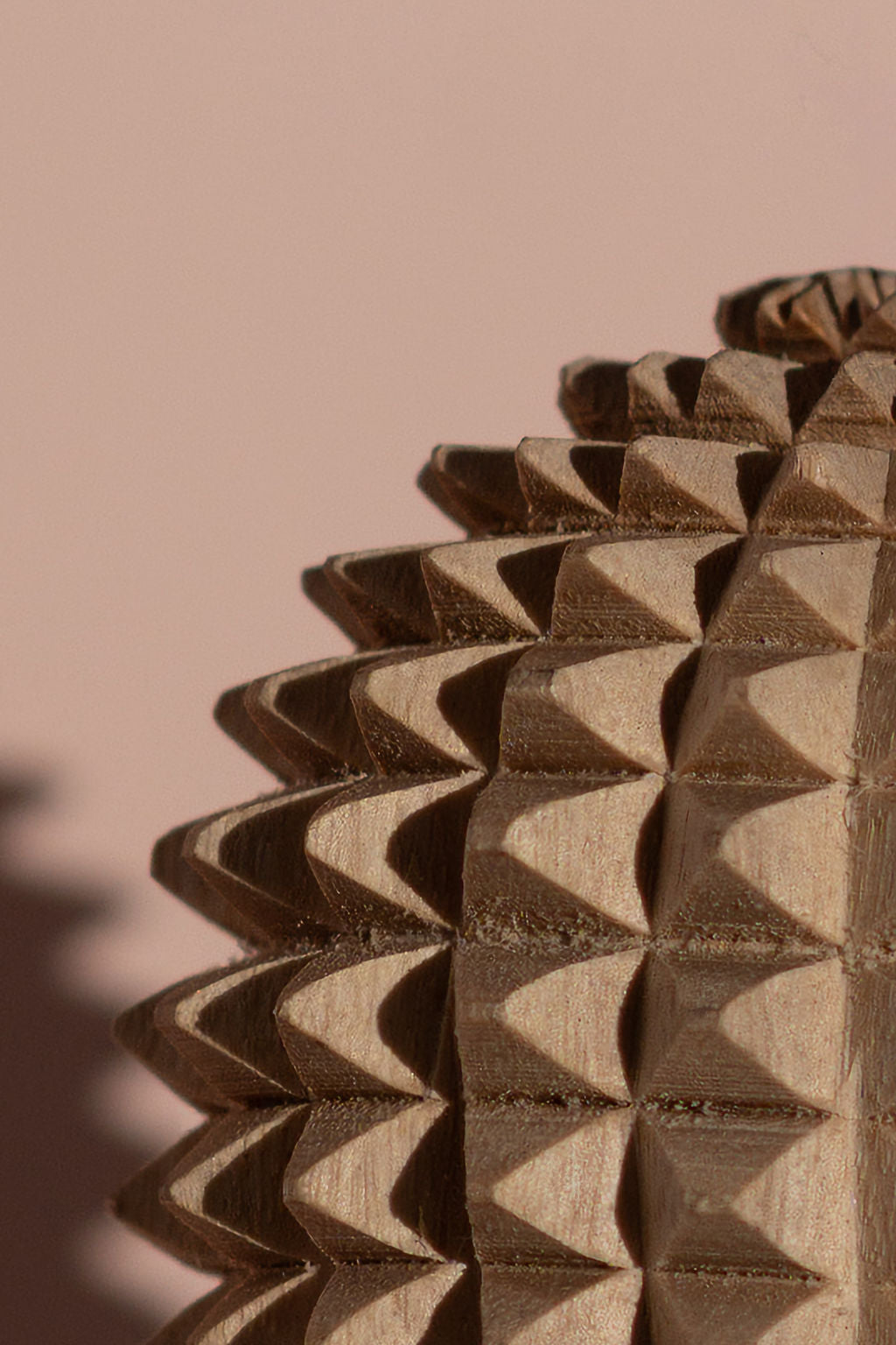 close up of calm companion handcarved wooden spikey ball